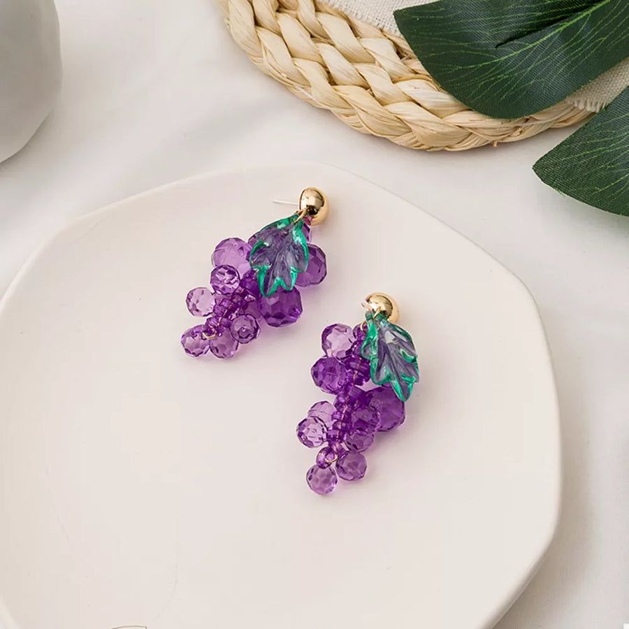 Grape-inspired beaded dangle earrings with purple acrylic beads and green leaves.