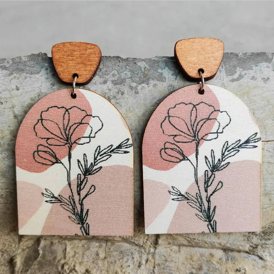 Botanical arch wood earrings in dusty pink with floral line art and boho abstract shapes.