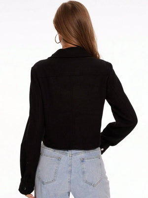 Black trucker jacket with snap buttons and long sleeves, shown from the back.