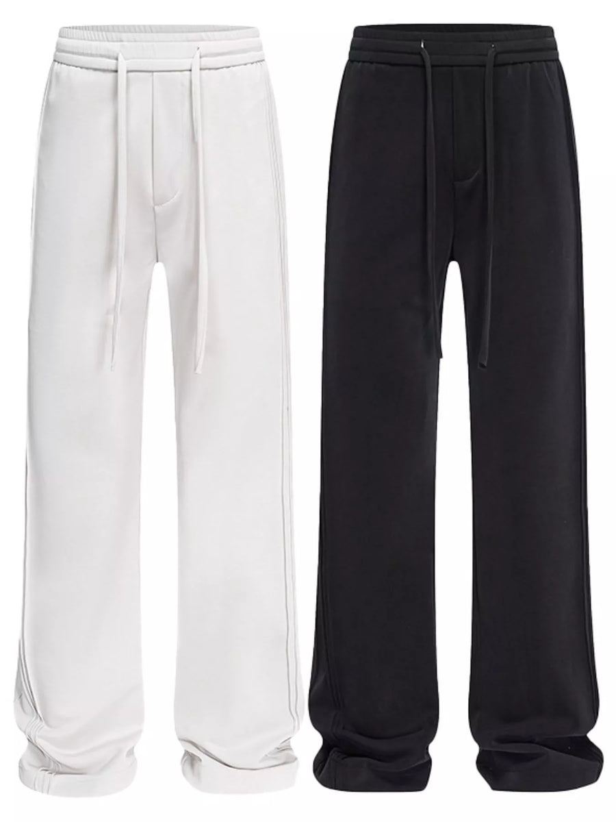 Relaxed fit drawstring casual pants in light gray and black with a cotton blend material.