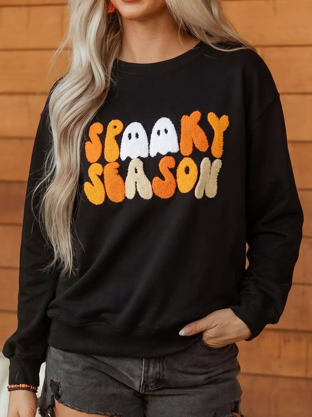 black sweatshirt with graphic-print and round neck