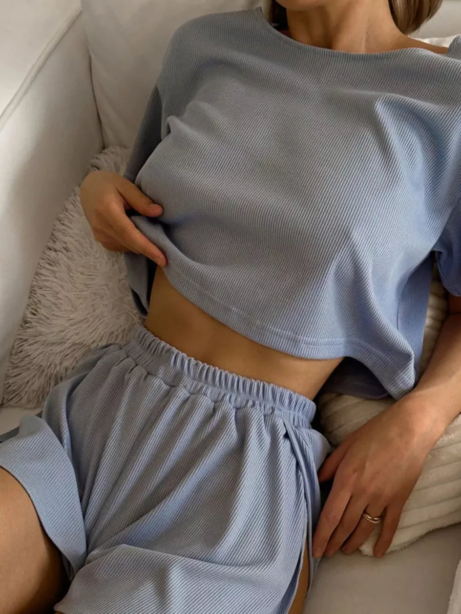 Light blue ribbed knit cropped lounge set with shorts and a relaxed fit top.