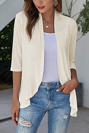 Cream asymmetrical ruffle hem cardigan with 3/4 sleeves and open front.