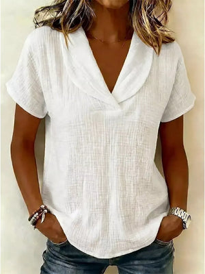 White textured blouse with short sleeves and a V-neck collar, casual everyday wear.
