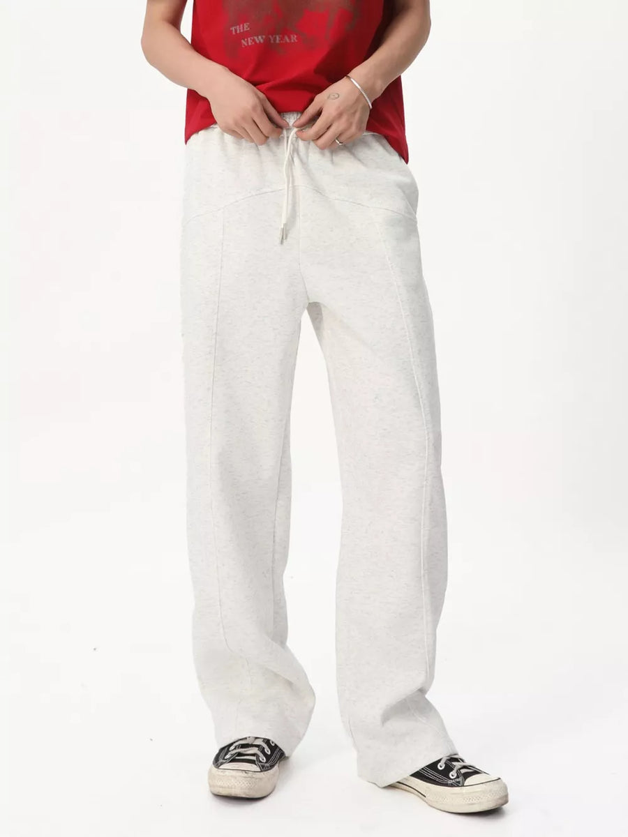 Men's cream cotton drawstring wide-leg sweatpants with a relaxed fit.