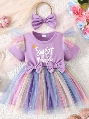 Lavender baby dress with rainbow tulle skirt, two bows, and matching headband.