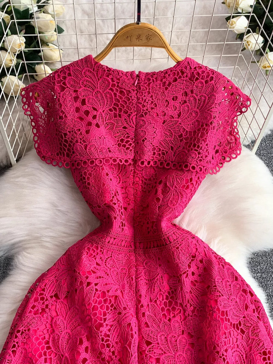 Fuchsia pink lace A-line dress with cap sleeves and cutout detail.