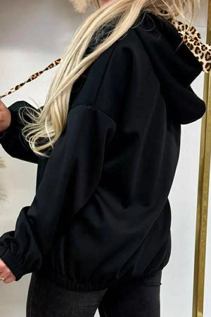 Black pullover hoodie featuring drawstring and leopard-print