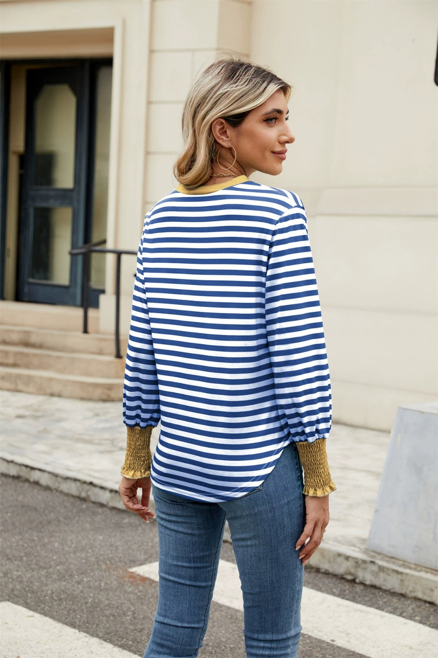 Striped long sleeve blouse with mustard cuffs and neckline.