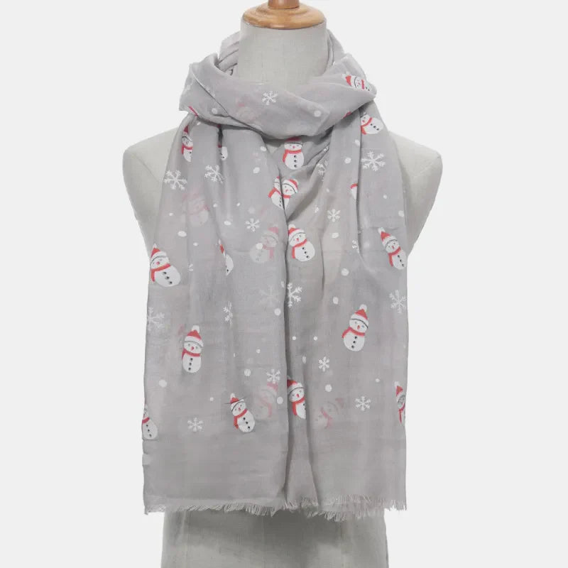 Light gray scarf with a festive snowman and snowflake print, frayed hem.