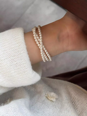 silver bracelet featuring three layers and geometric
