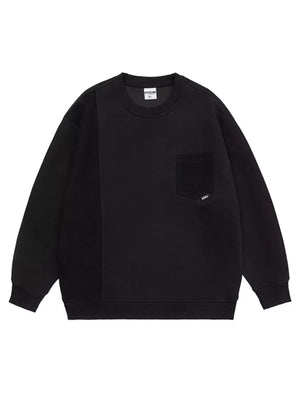 Black crewneck sweatshirt with contrasting textured panel and chest pocket