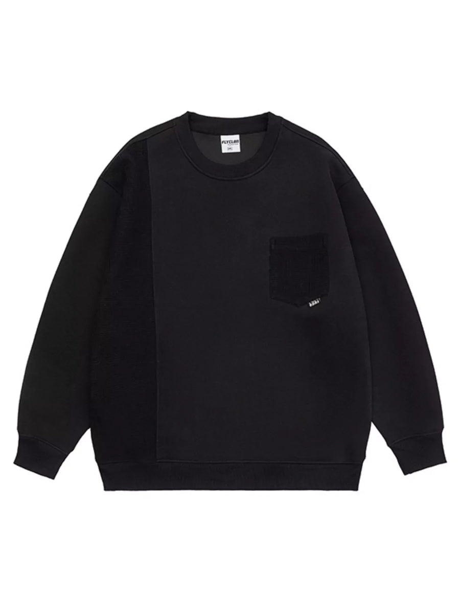 Black crewneck sweatshirt with contrasting textured panel and chest pocket