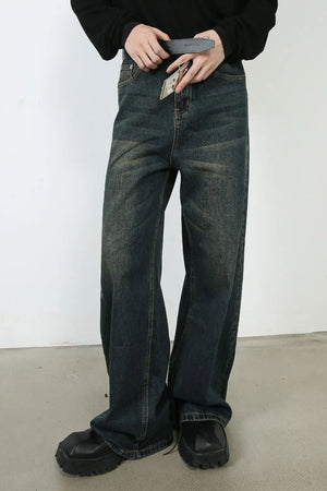 Faded dark denim wide-leg trousers with a relaxed fit.