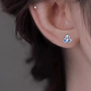 silver earrings featuring enamel detail and floral