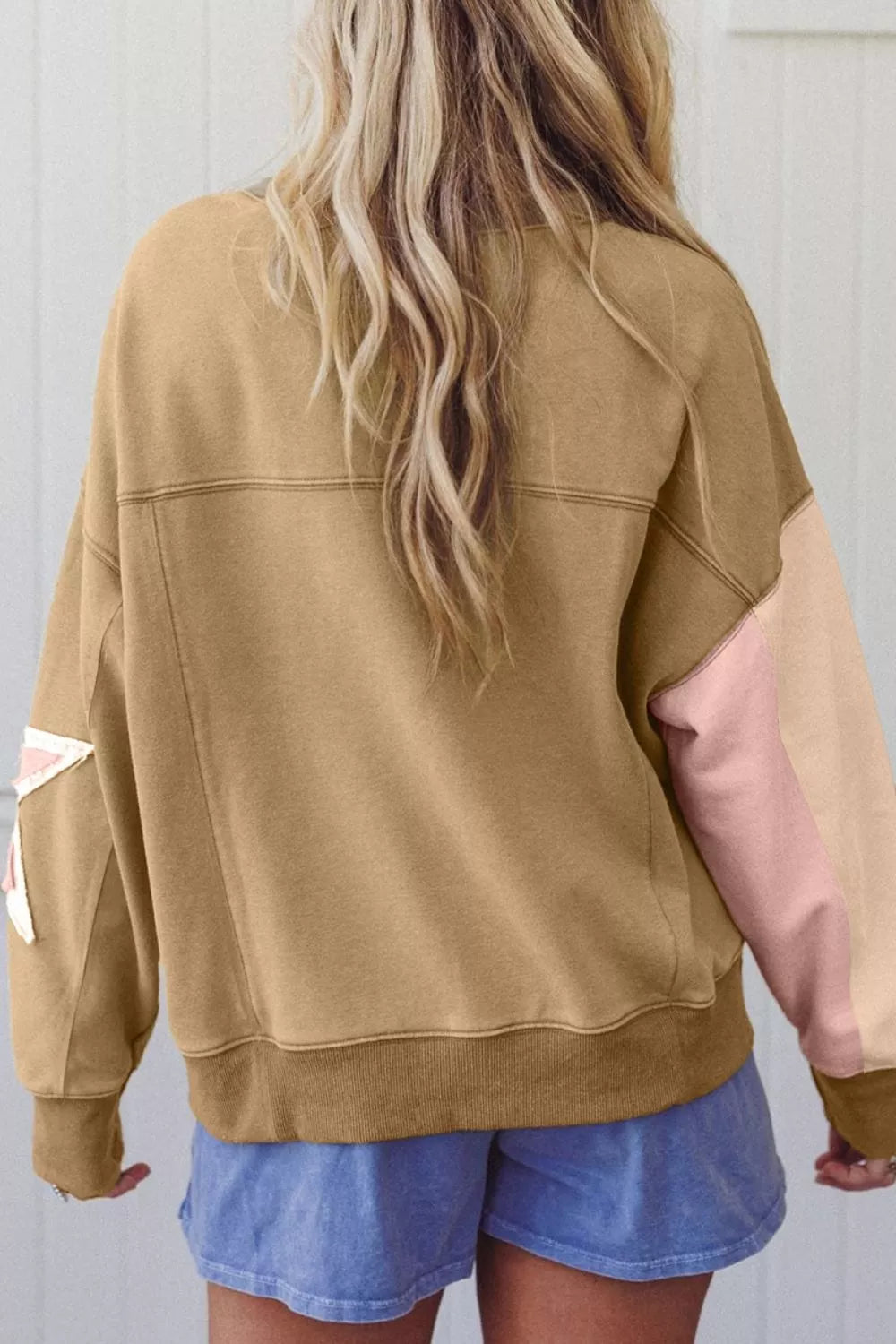 blush pink sweatshirt featuring oversized and star