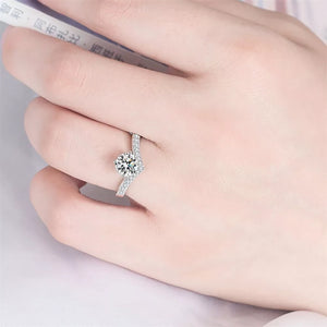 Dazzling sterling silver ring with a brilliant 2ct moissanite and pave band.