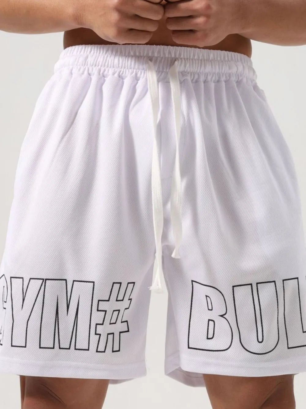 White mesh graphic gym shorts with drawstring and elastic waist.