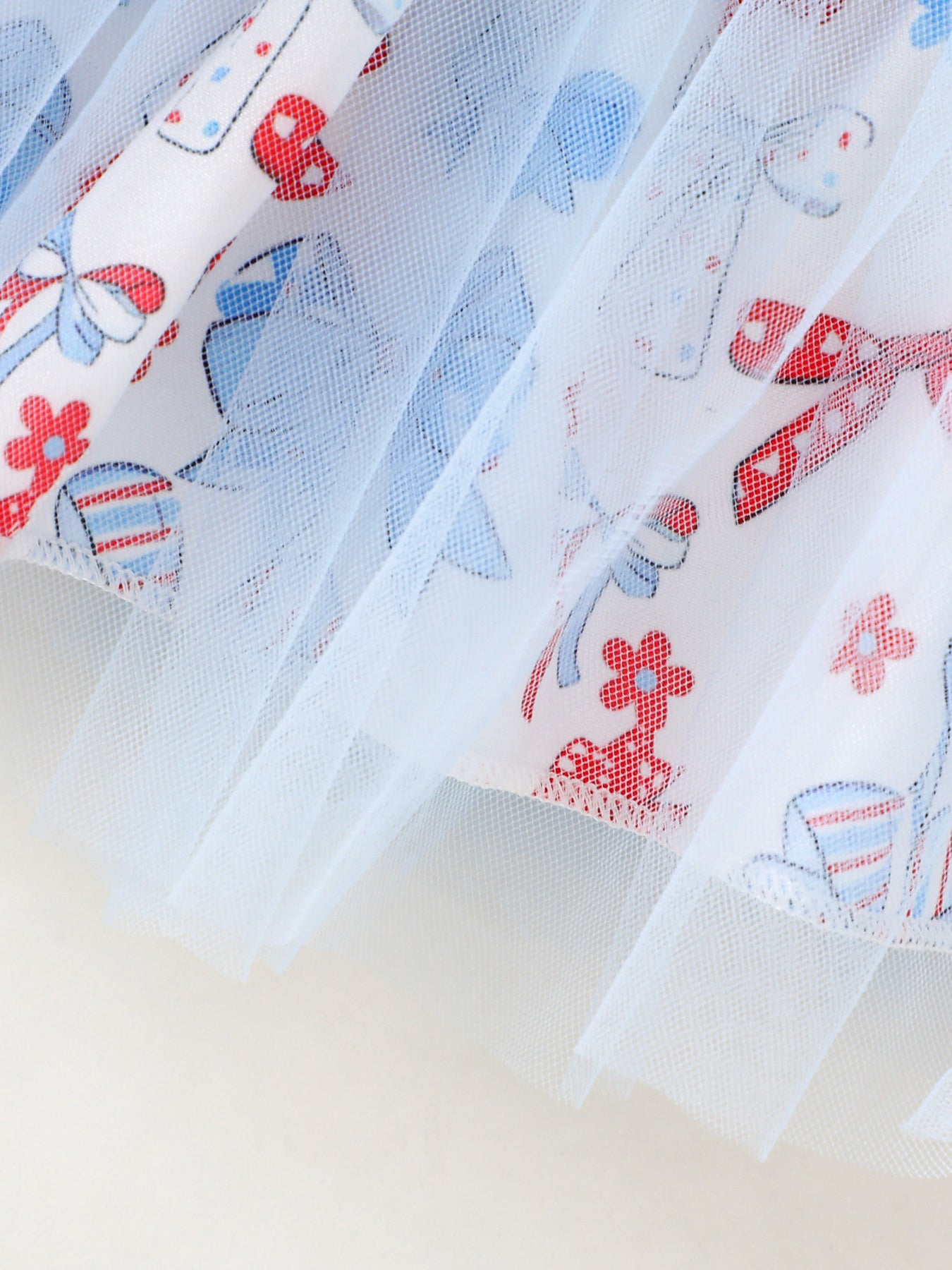 Baby outfit with patriotic print and blue tulle trim