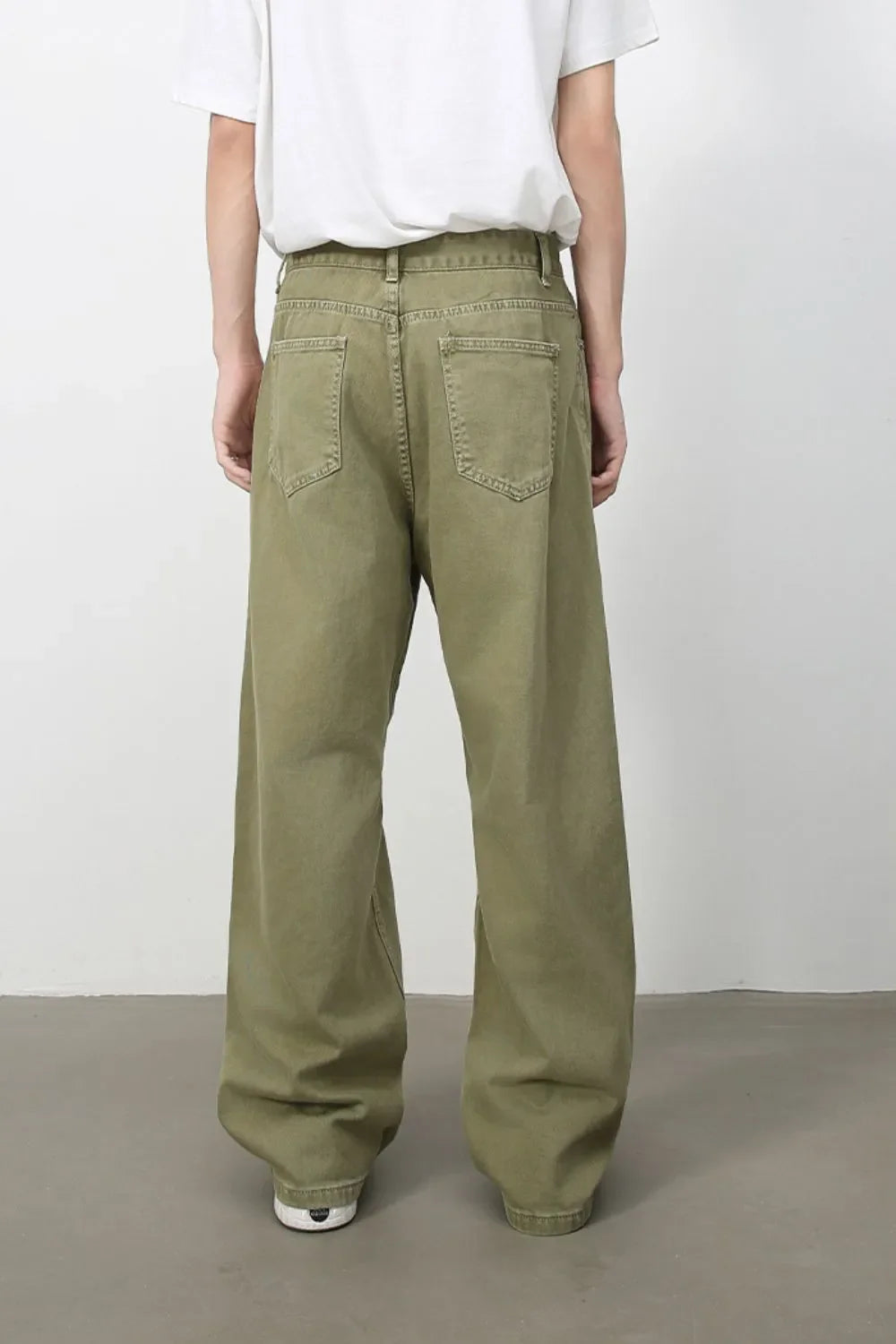 Wide-leg rigid denim trousers in yellow-green with a relaxed fit and classic five-pocket styling.