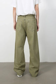 Wide-leg rigid denim trousers in yellow-green with a relaxed fit and classic five-pocket styling.