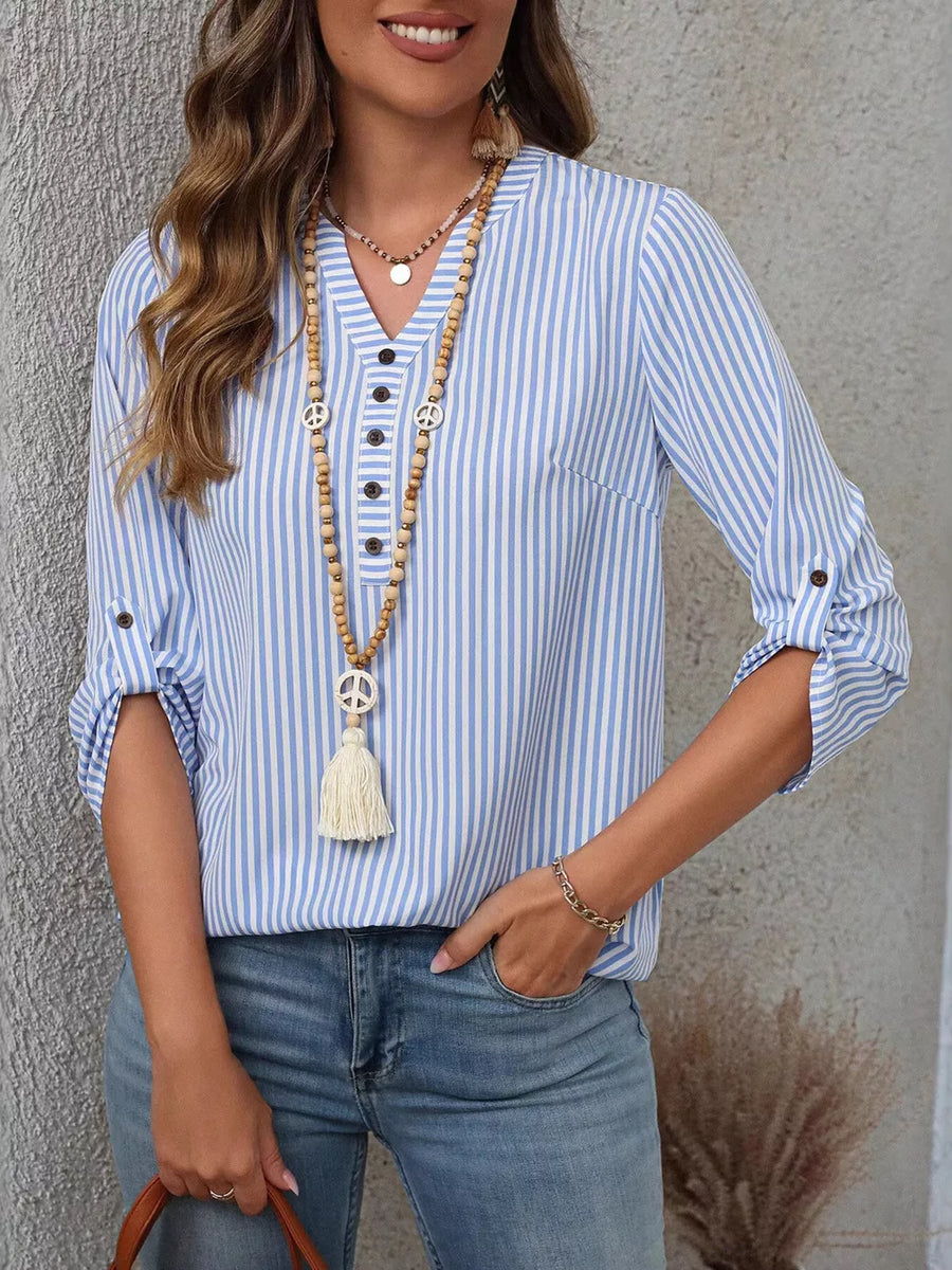 Light Blue Strip vertical stripe v-neck blouse with roll-up sleeves and button detail.