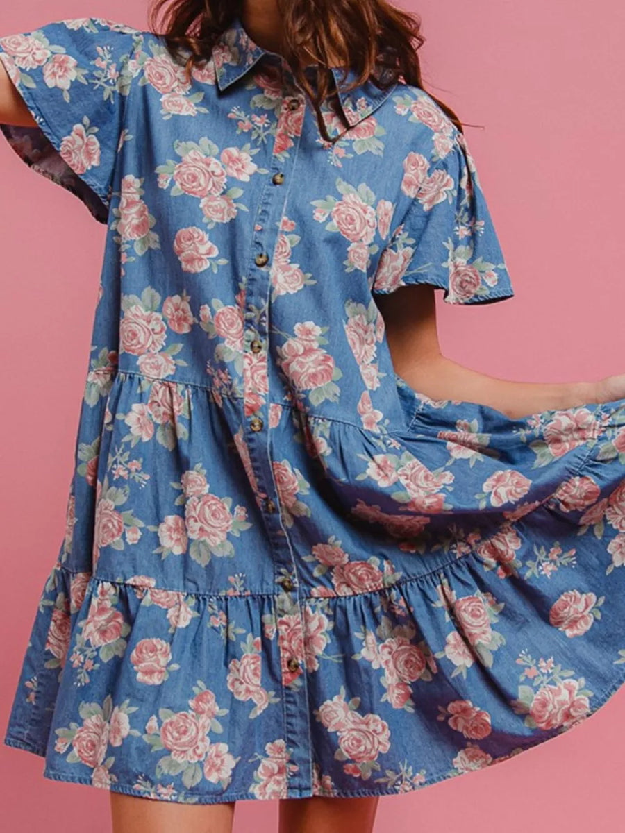 Light blue floral denim mini dress with ruffled tiers and short sleeves.
