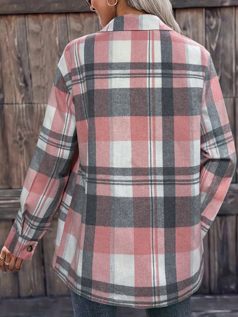 Oversized plaid shirt jacket in dusty pink with relaxed fit and buttoned cuffs.