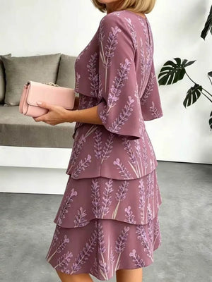Purple floral tiered ruffle hem dress with bell sleeves and above-knee length.