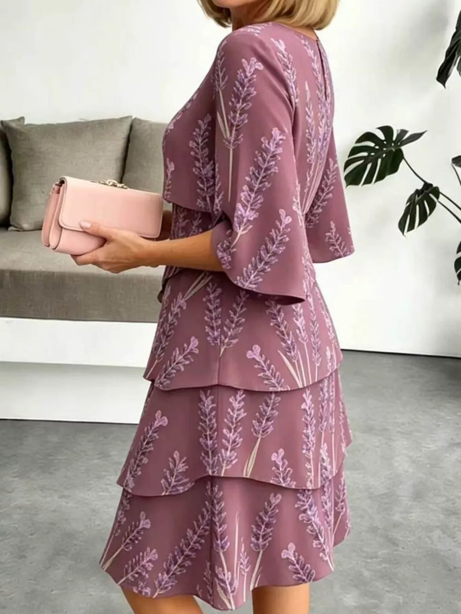 Purple floral tiered ruffle hem dress with bell sleeves and above-knee length.