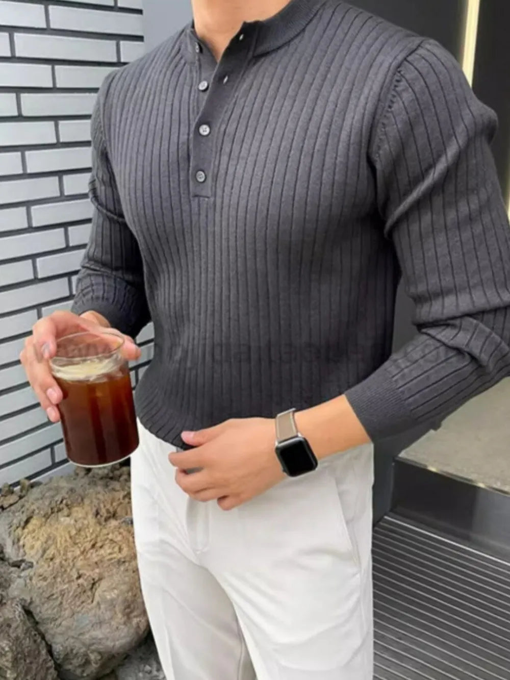 Dark gray ribbed knit Henley sweater with button accents and long sleeves.