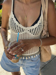 Intricate crochet knit cami vest in cream with openwork detail, worn over a black bikini top.