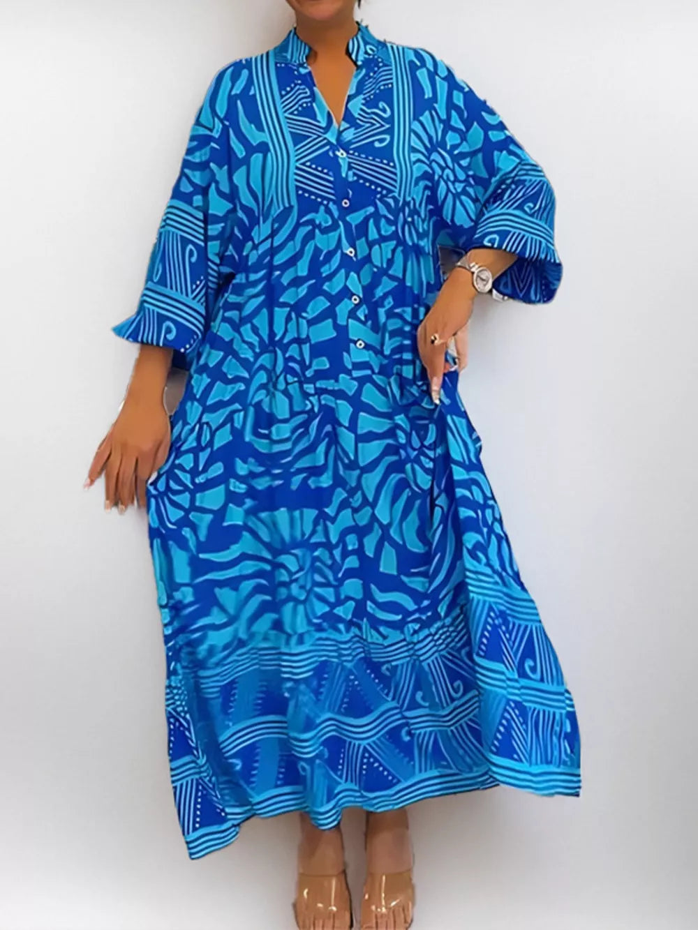 Vibrant abstract print midi dress in sky blue with a collared neckline and button front.
