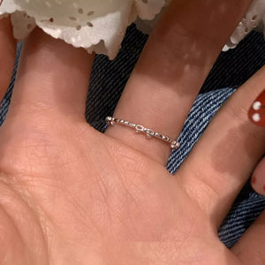 Delicate sterling silver ring with a dainty bow design.