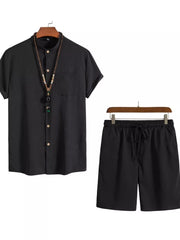 Black buttoned short-sleeve shirt with mandarin collar and drawstring shorts.