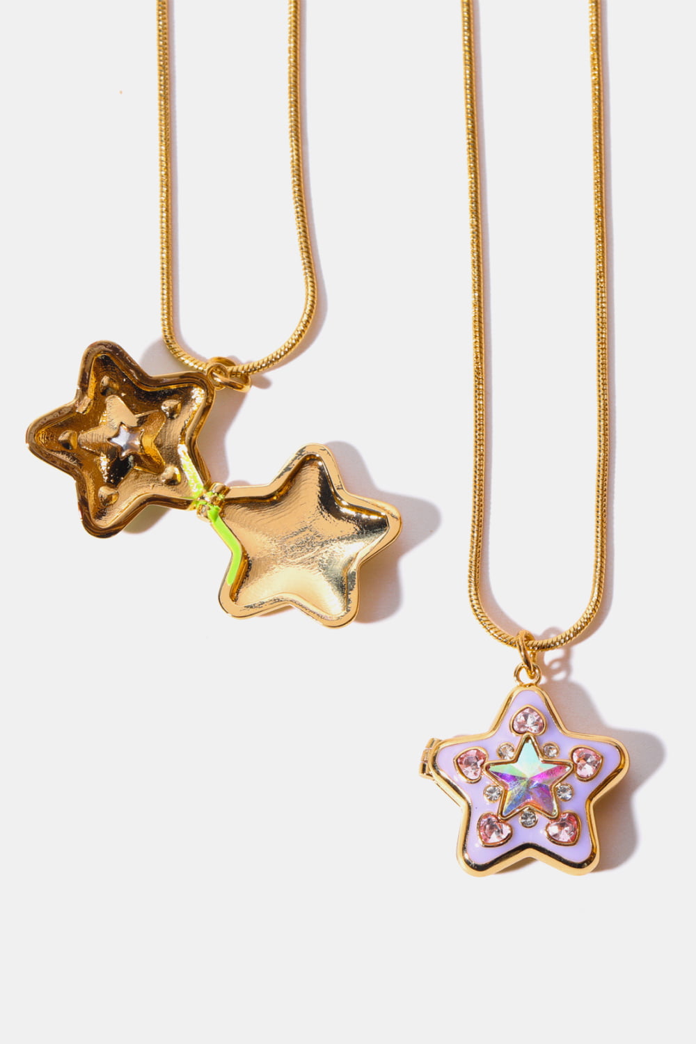 Locket starburst pendant necklace in lavender with crystals and a gold chain.