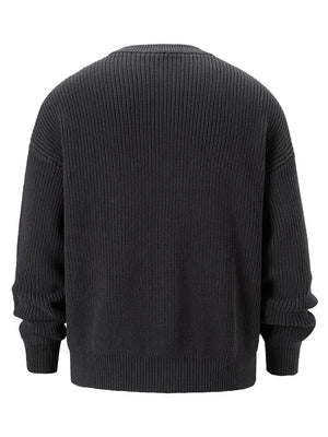 Dark gray ribbed knit oversized sweater with crew neck and long sleeves.