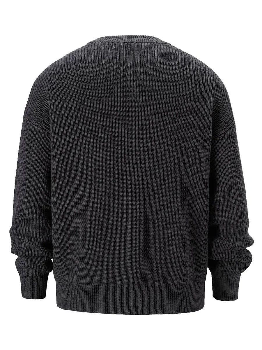 Dark gray ribbed knit oversized sweater with crew neck and long sleeves.