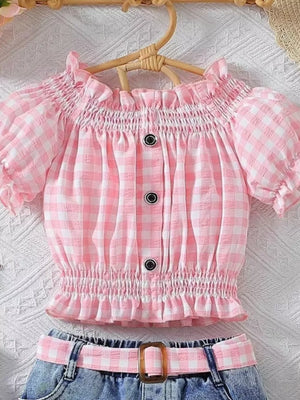 Pink gingham baby top with smocked bodice and ruffled sleeves, paired with denim shorts and matching belt.