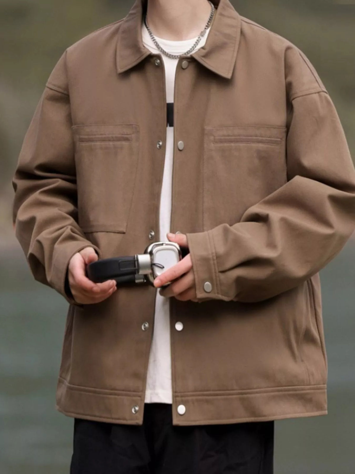 Oversized camel brown casual snap jacket with buttoned chest pockets and collar.