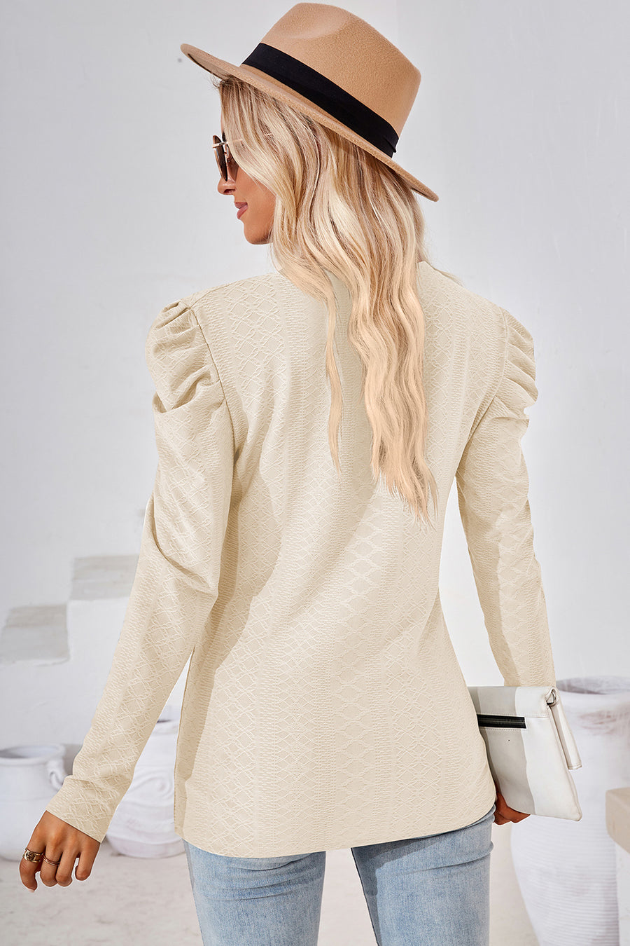 Cream textured puff-sleeve crew neck top with all-over diamond pattern.