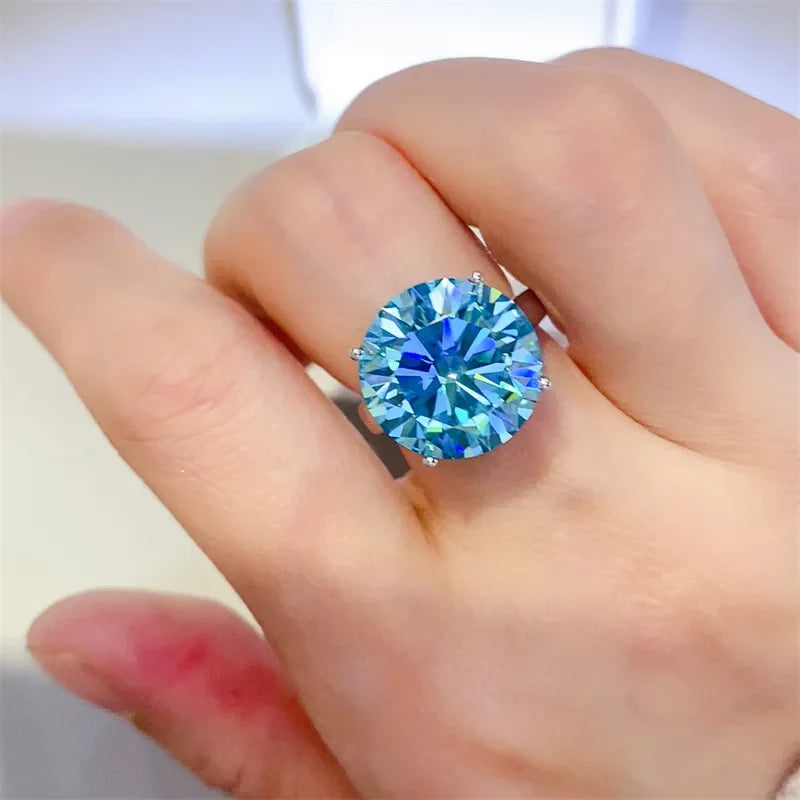 Silver ring with large bright blue stone