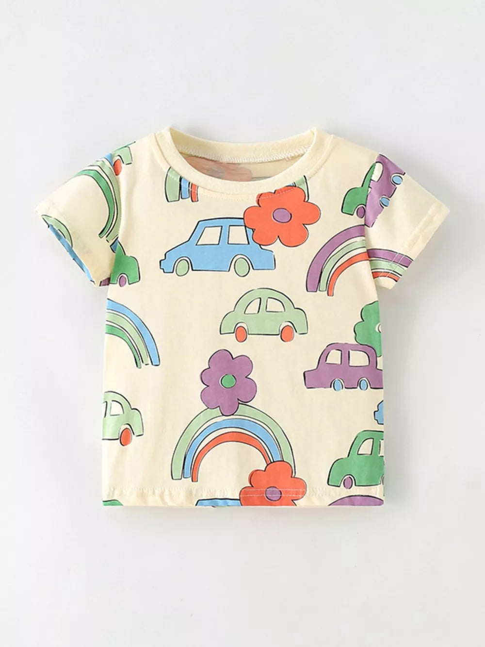 Baby t-shirt in light yellow cotton with a playful cartoon car and rainbow print.