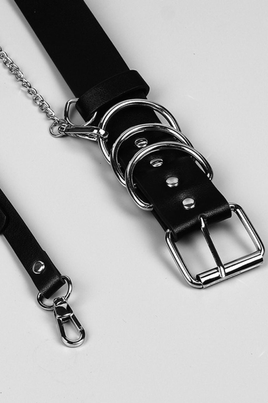 Black PU leather harness belt with silver chain and ring details