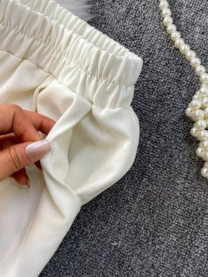 White belted two-piece set with pockets and elastic waistband detail