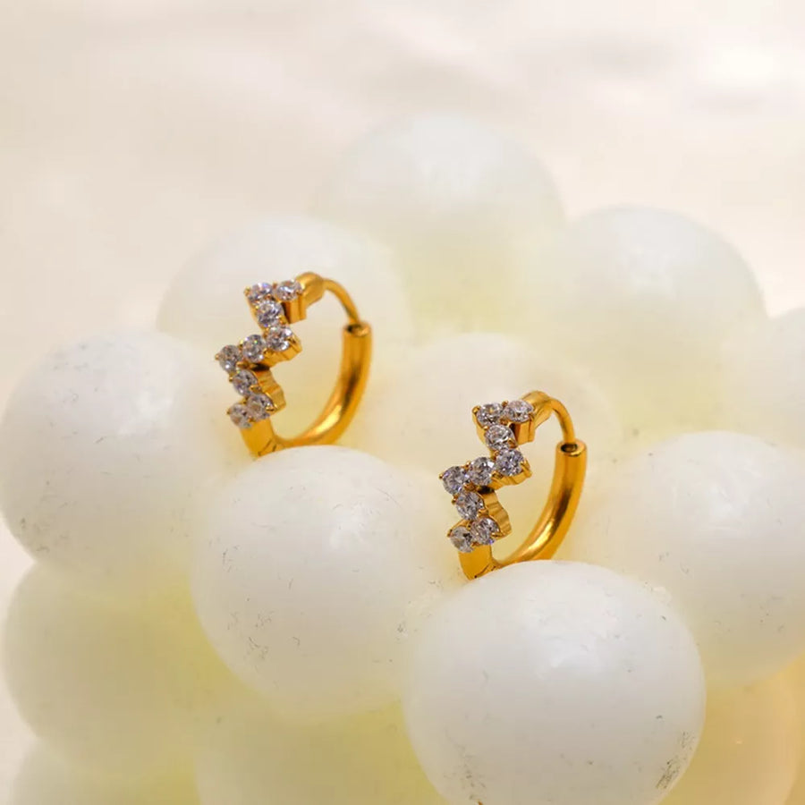 earrings in gold featuring zircon embellishment and hoop fit
