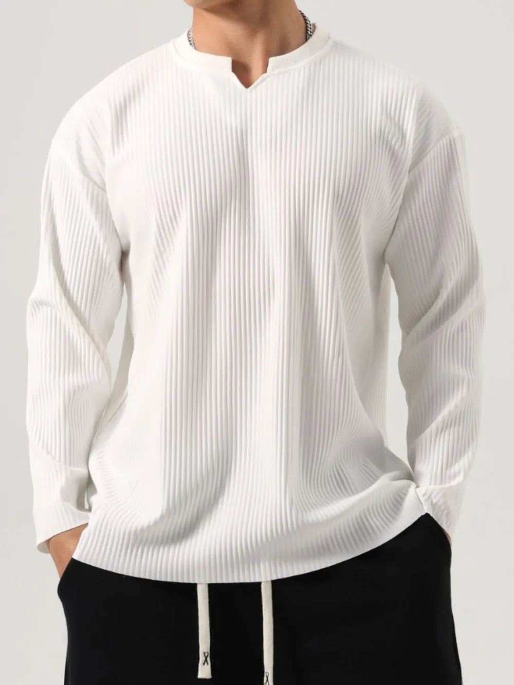 White textured plissé henley long sleeve top with notch neckline