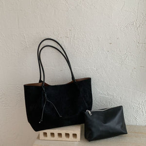 tote in black featuring long shoulder straps and boxy fit