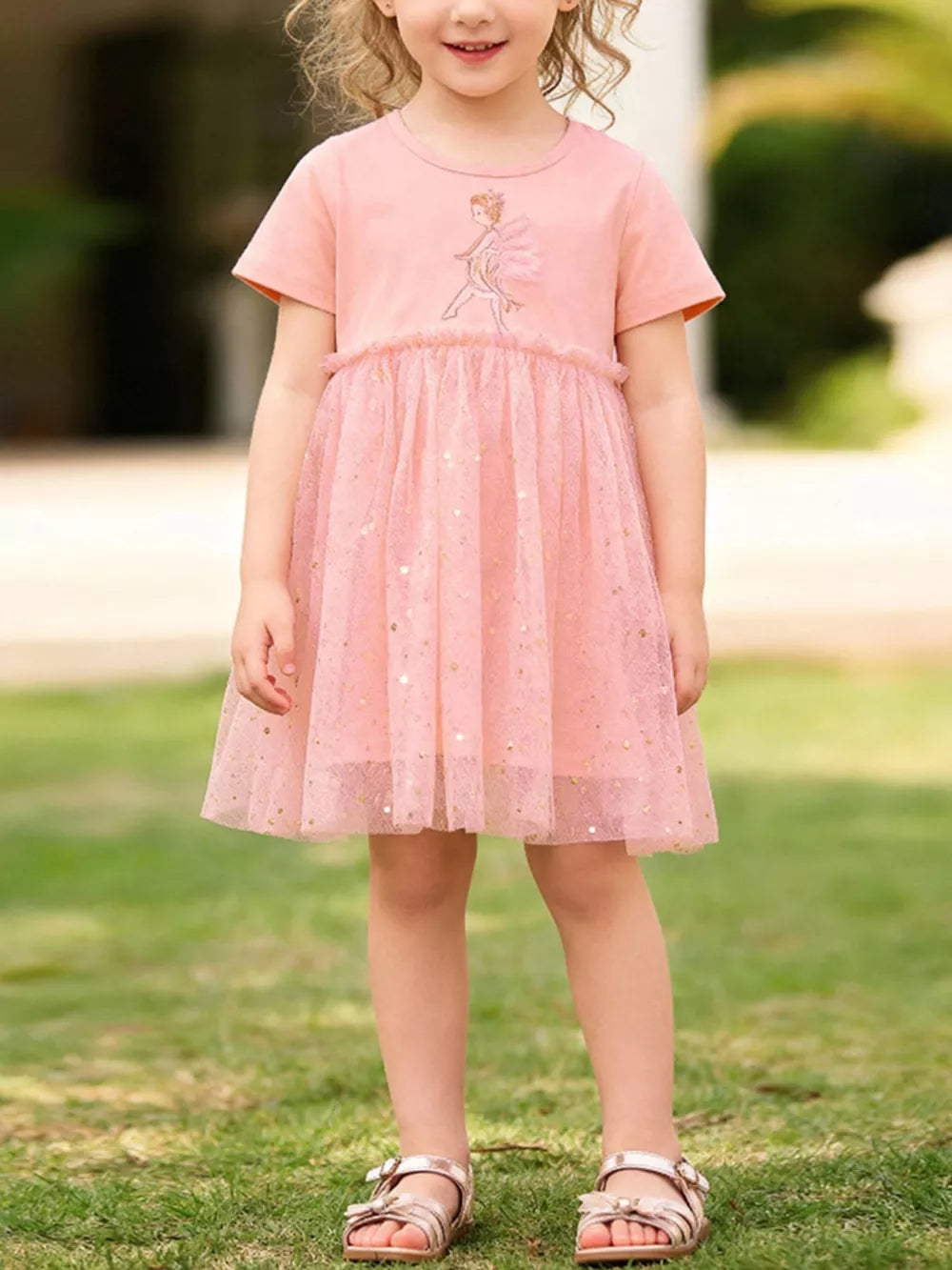 Pink baby dress with fairy embroidery and glittery tulle skirt.