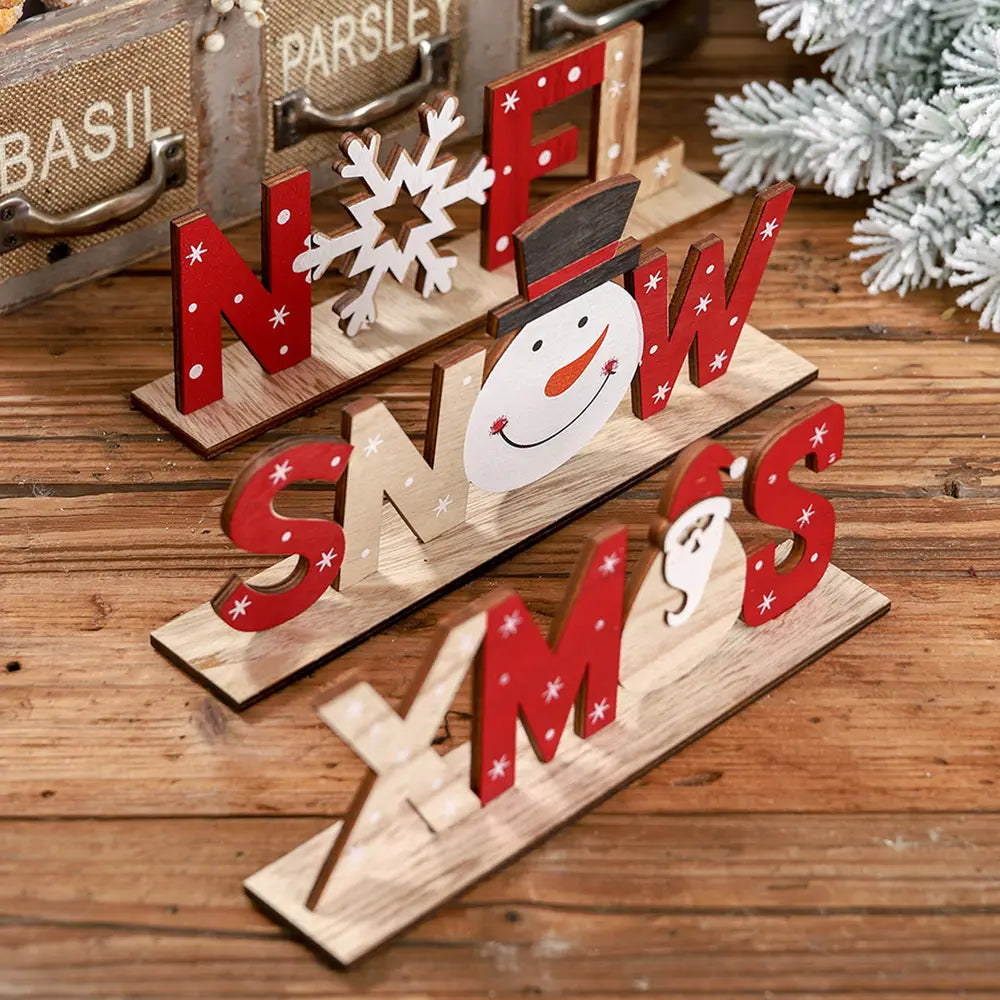Wooden word blocks with festive Christmas designs, including a snowman and Santa.